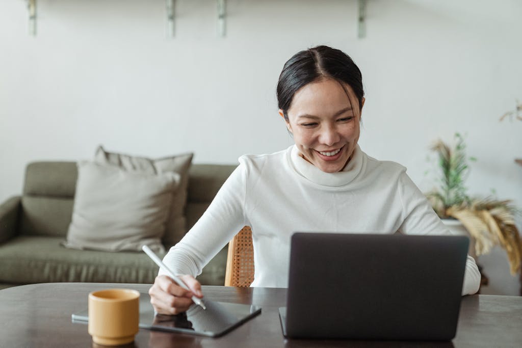 Introvert taking thoughtful notes during video interview demonstrating active listening skills