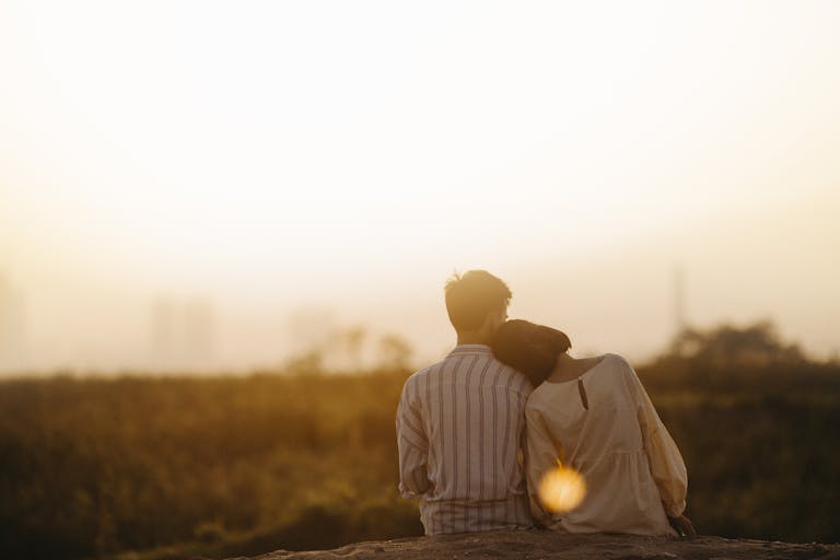 A couple enjoys a serene moment together during a sunset in Gia Lai, Vietnam.