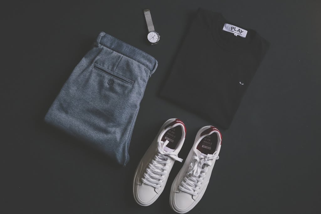 Stylish flat lay showing casual introvert wardrobe essentials with quality basics and thoughtful accessories