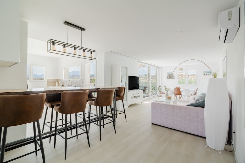 Minimalist white interior space representing acoustic calm and visual peace for introvert sanctuary