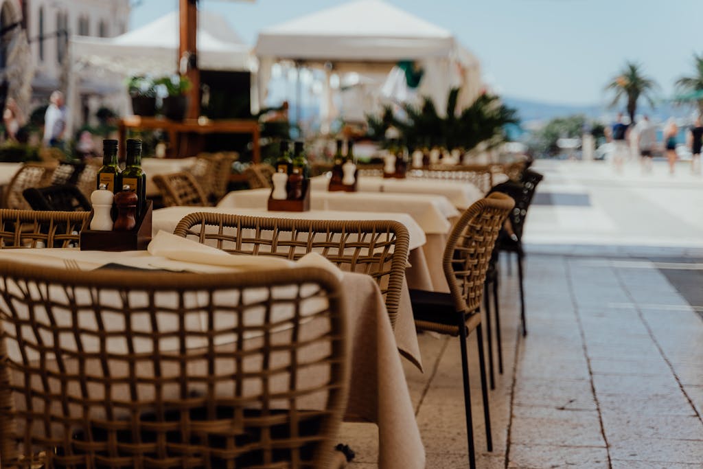 Quiet outdoor cafe restaurant with empty tables perfect for solo introvert dining while traveling