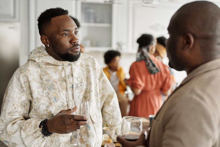 ISTJ couple socializing with diverse friends, representing their intentional effort to seek outside perspectives and avoid becoming too insular