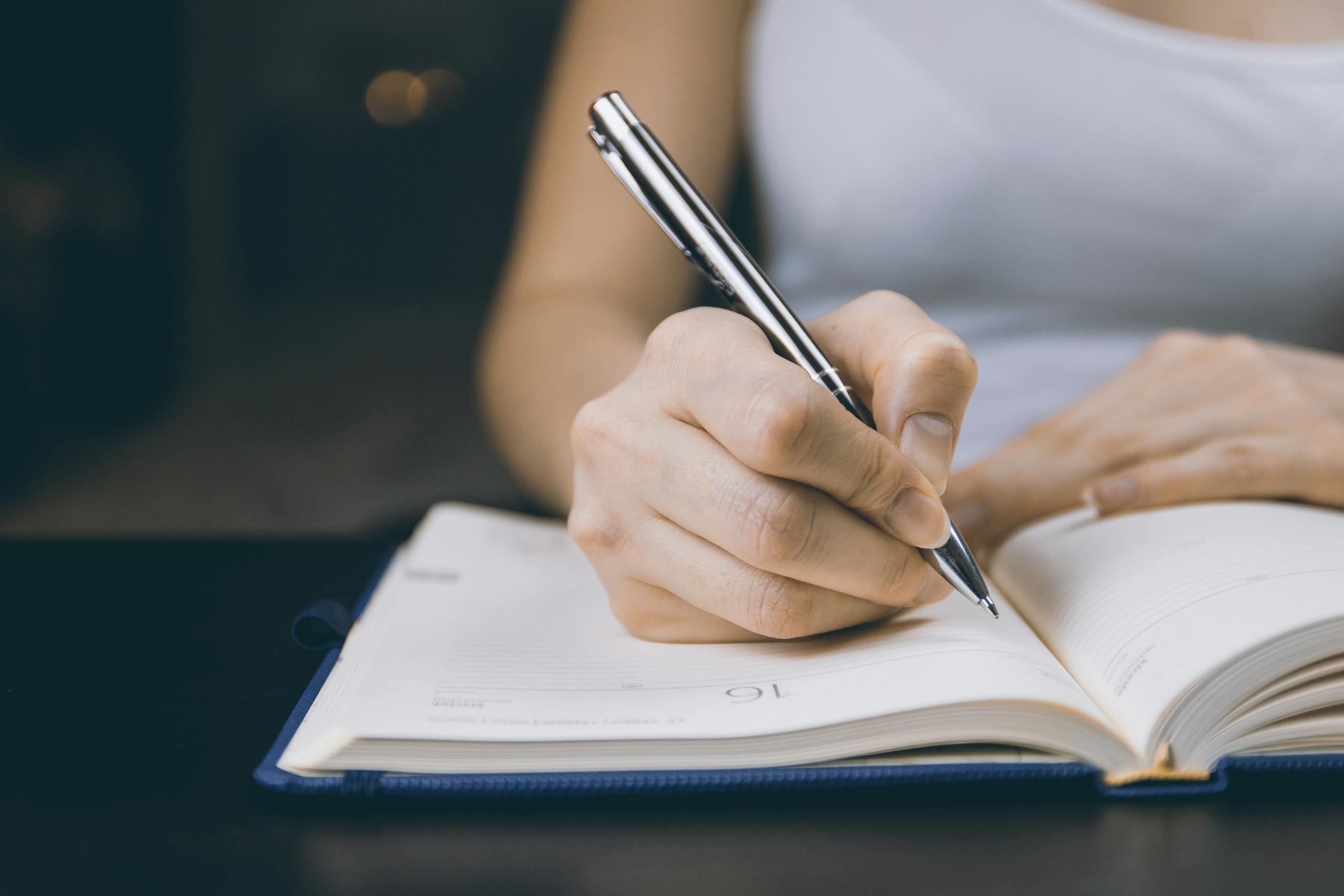 Person journaling to process conflict through introverted feeling
