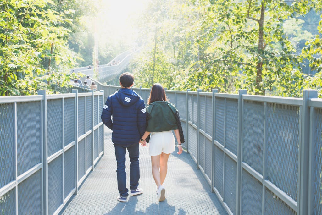 A couple walking together on a quiet path, symbolizing the deep emotional bond and shared journey of two INFJs in relationship