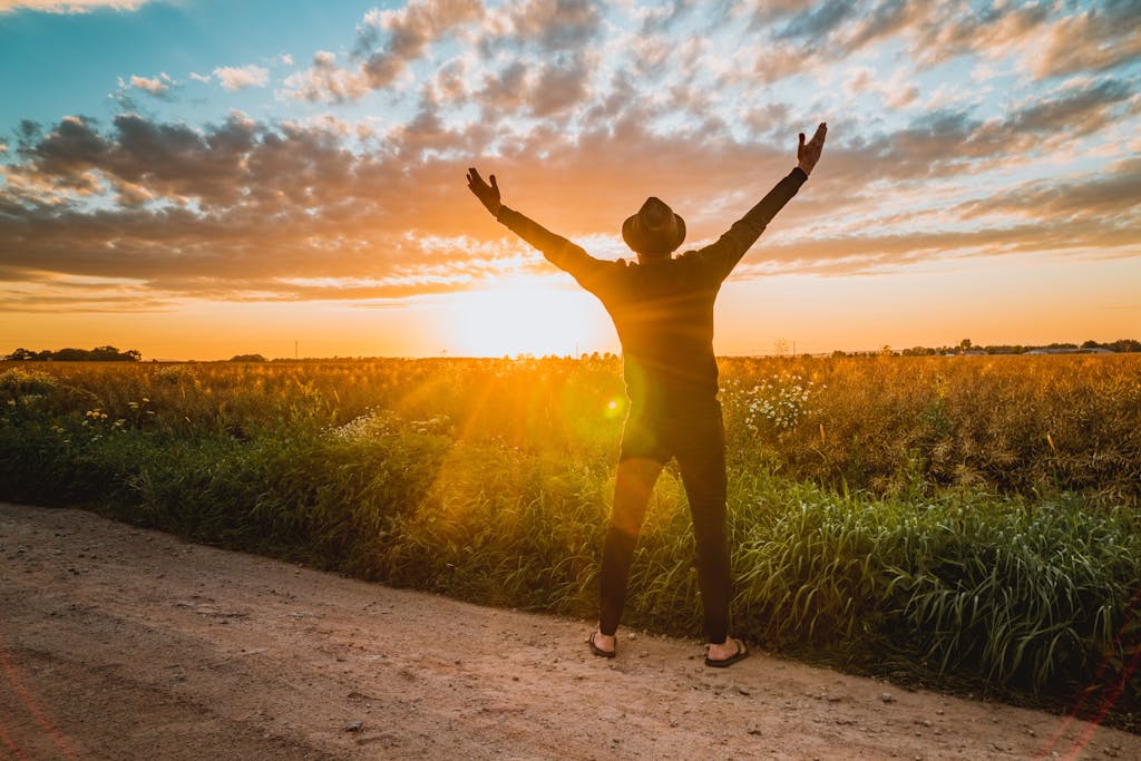 Professional looking hopeful at sunrise, representing new beginnings after leaving a toxic workplace