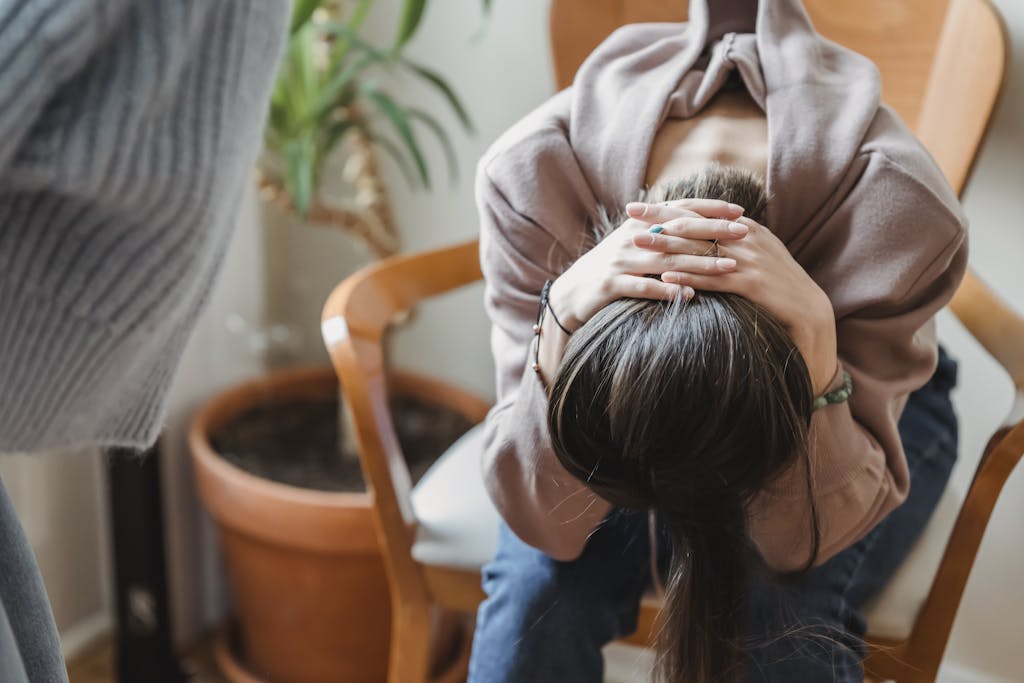 Woman experiencing introvert anxiety crisis showing emotional distress and overwhelm requiring immediate anxiety management intervention and professional support