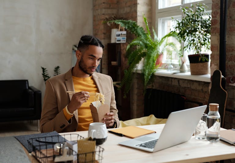 Professional sitting alone at desk contemplating career identity and job title significance
