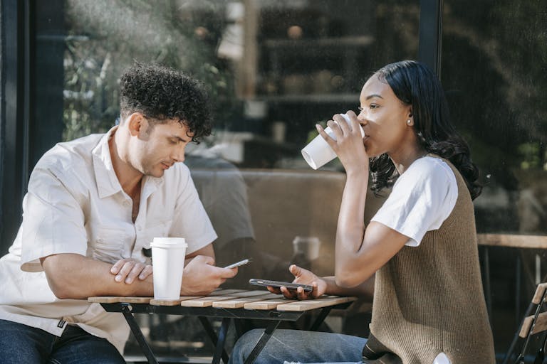 Two introverts sitting together in comfortable silence, representing the peaceful connection that forms between introvert partners