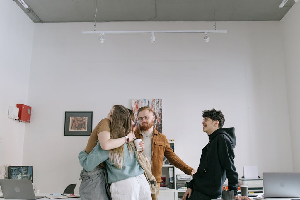 ESTJ professional in meeting room dealing with younger employee promotion announcement and organizational restructuring