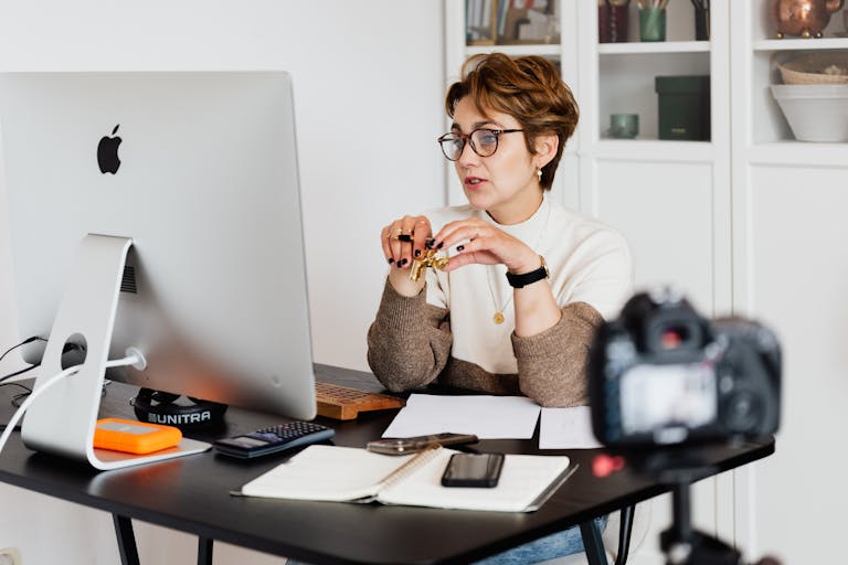 Professional working at desk contemplating career specialization decisions with documents spread out showing income charts and career planning materials