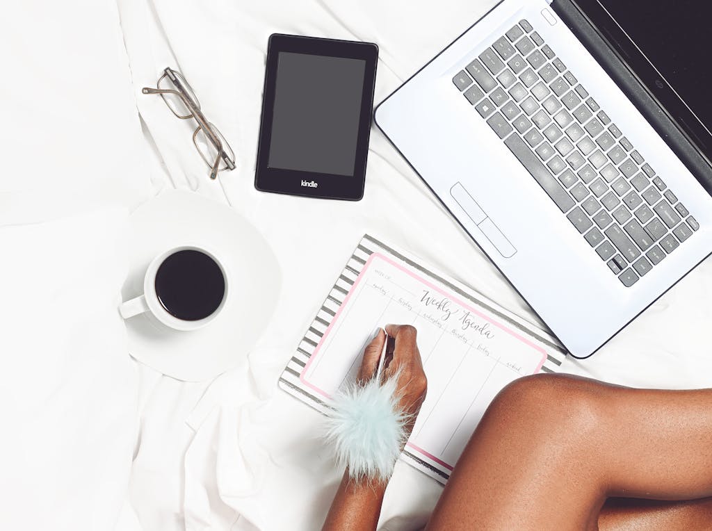 Professional preparing for interview with notes and laptop, showing strategic career transition planning