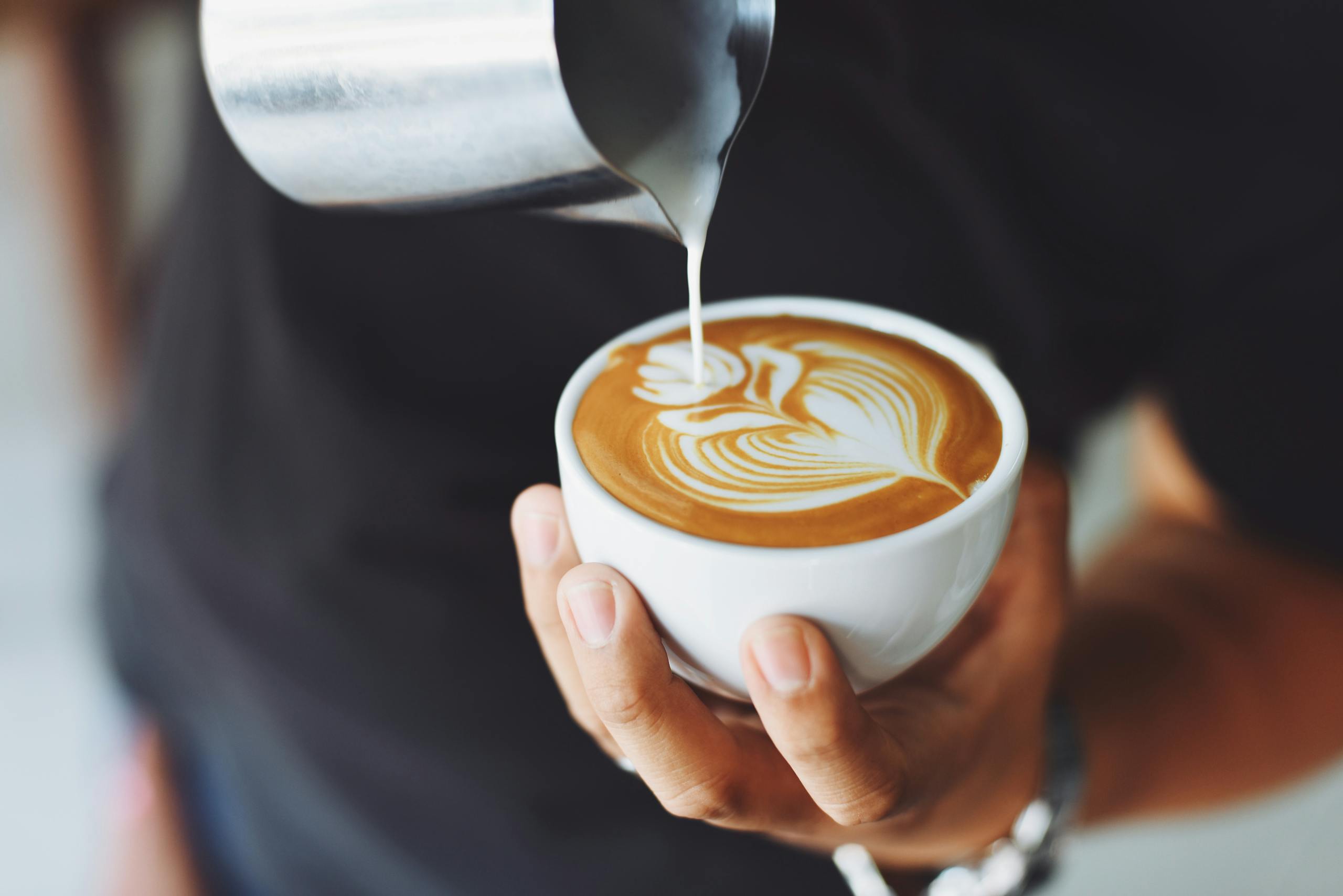Hands preparing coffee exactly the right way showing love through remembered preferences