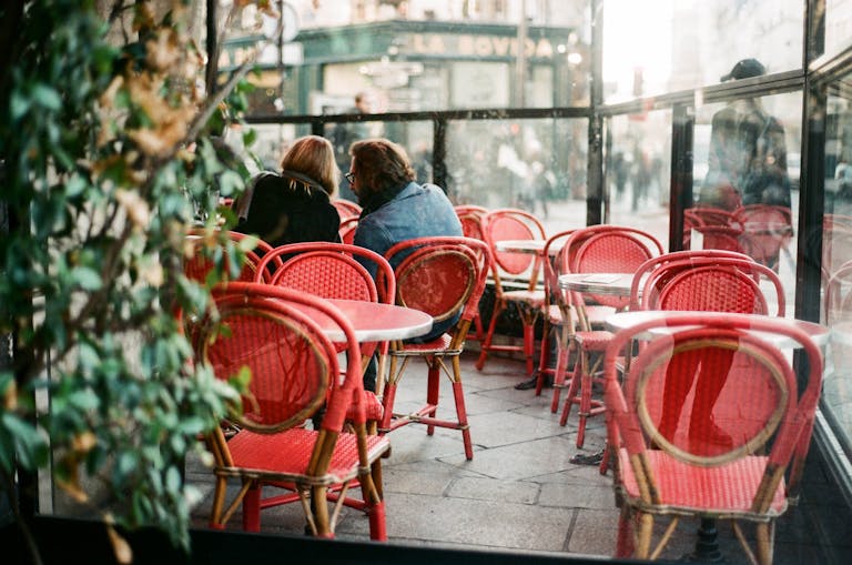 Two people having a quiet conversation over coffee, illustrating supportive listening without judgment