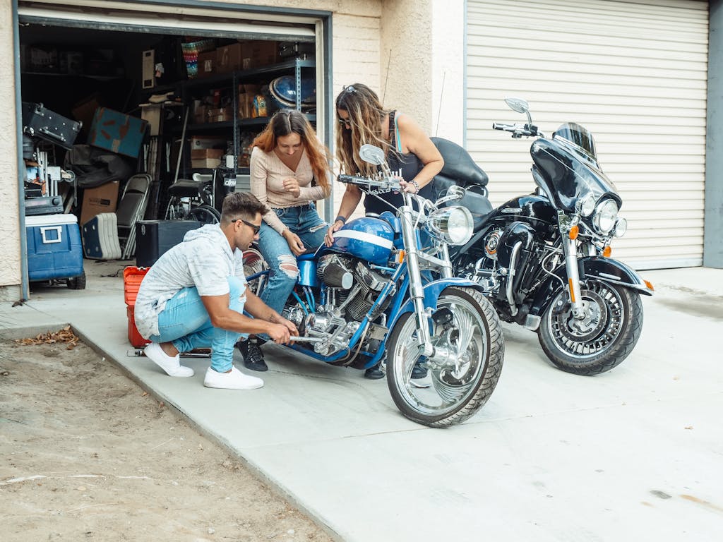 Two ISTPs working together on a mechanical project in a garage workshop