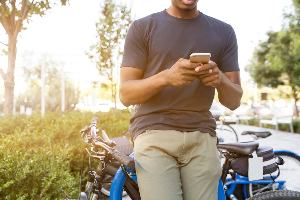 Hands typing a thoughtful message on a smartphone
