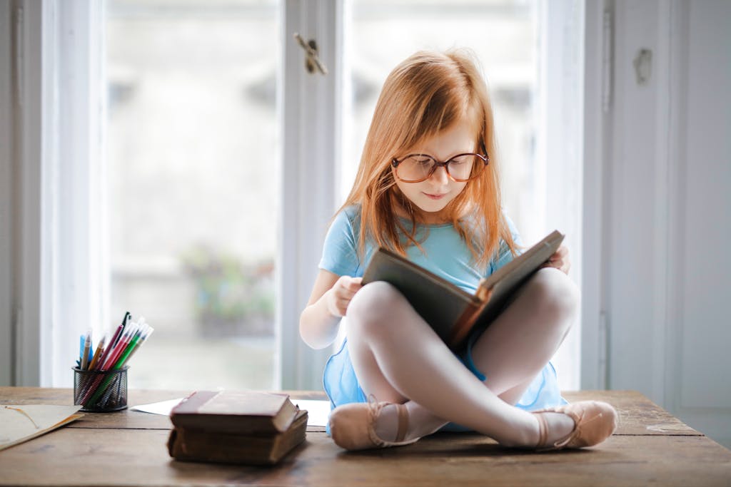 Child reading quietly alone showing introverted energy preferences