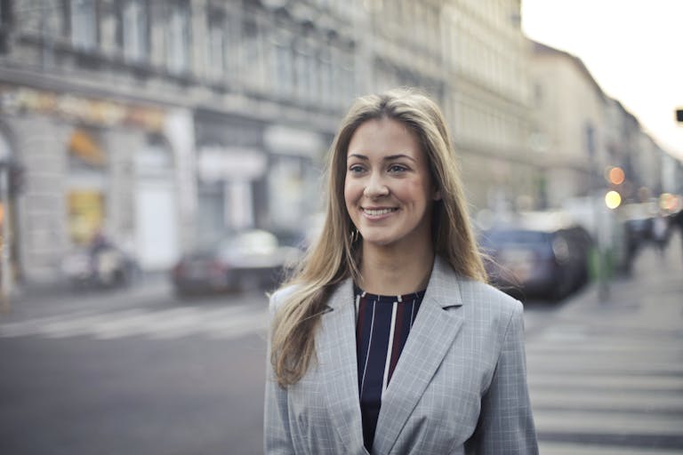 Professional looking confident after successful presentation showing personal growth