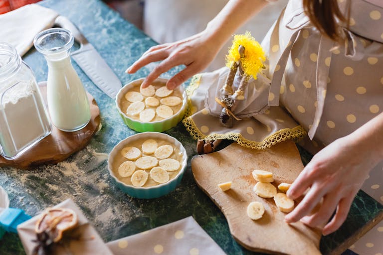 Person preparing a balanced breakfast in a calm morning kitchen setting representing optimal meal timing for energy