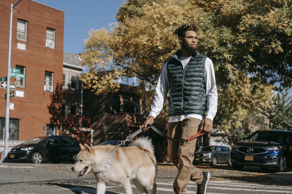 Person walking through a new neighborhood, exploring their surroundings while maintaining a comfortable distance from crowds