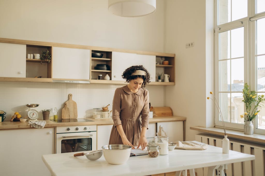 Solo introvert peacefully preparing a meal in a calm, organized kitchen environment