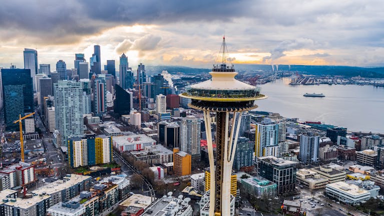 Stunning aerial shot of Seattle's skyline featuring the iconic Space Needle at sunset.