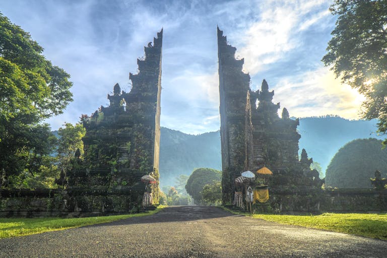 Stunning view of the Handara Gate in Bali with mountains and lush greenery.