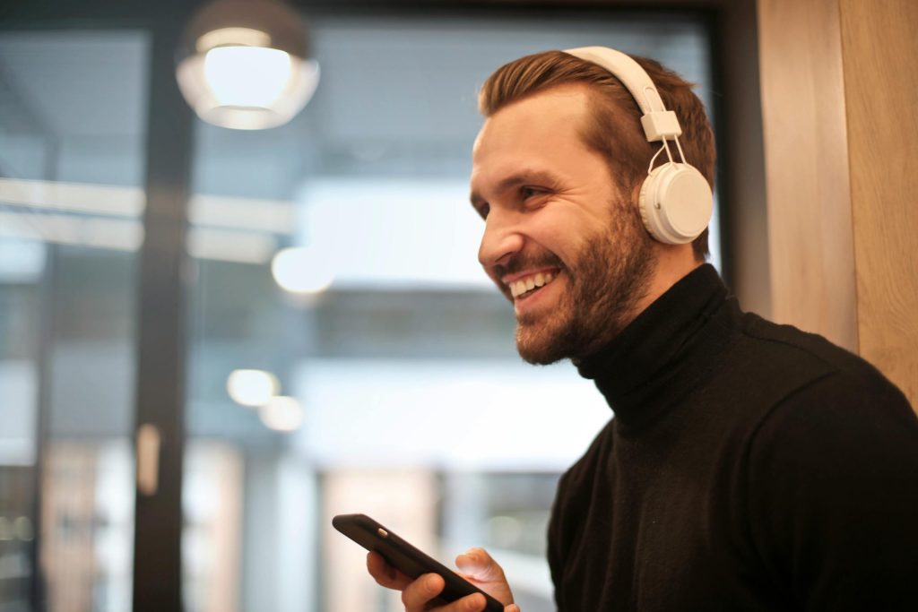 Introvert working focused with headphones building financial independence