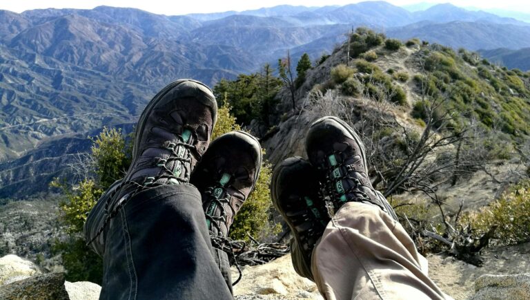 Couple hiking together on mountain trail enjoying comfortable silence