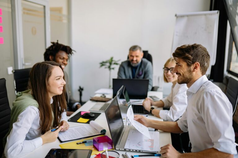 Diverse group of professionals collaborating in modern office meeting