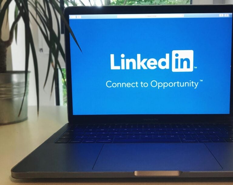 Laptop screen displaying LinkedIn logo with text connect to opportunity messaging.