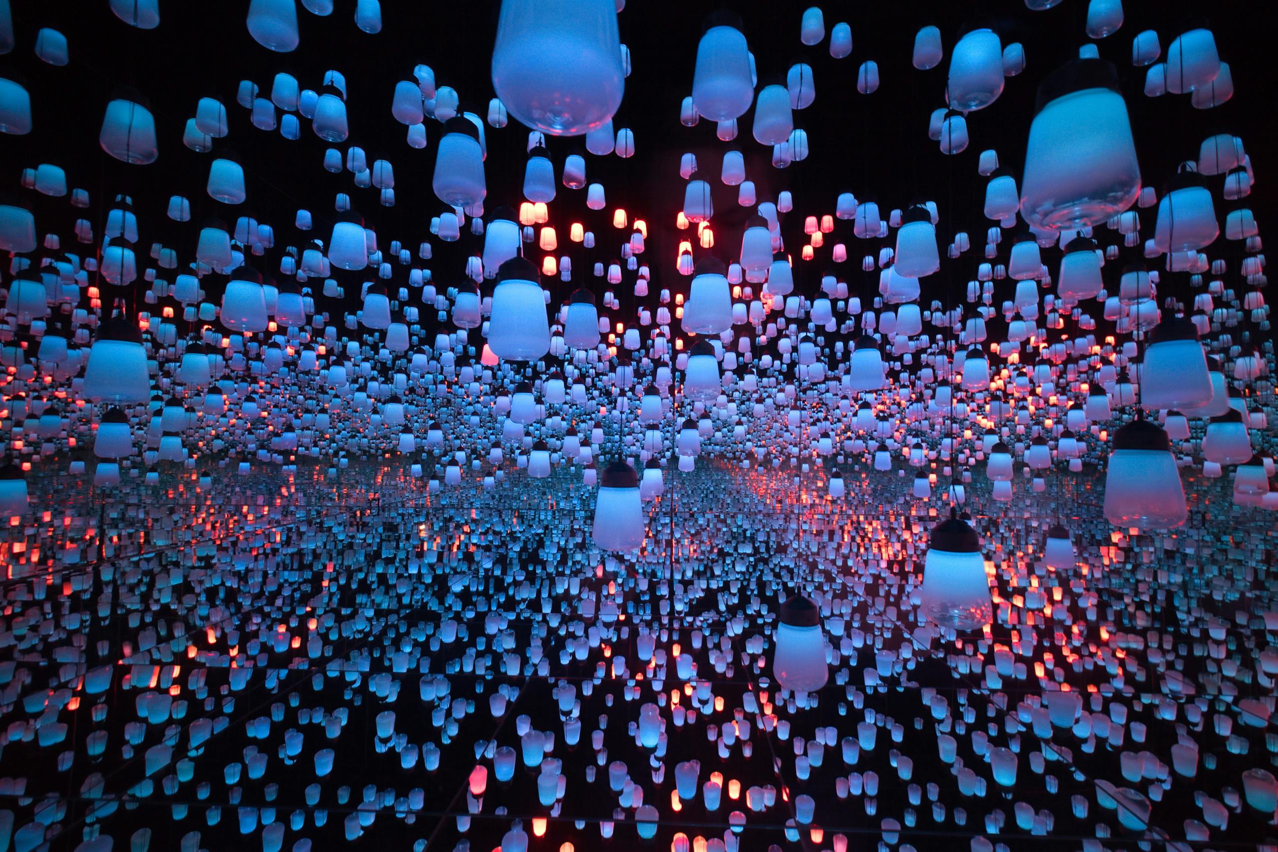 Mesmerizing display of colorful hanging lanterns in Tokyo art museum interior.