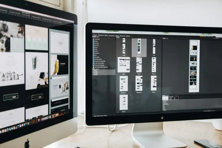 Modern workspace with dual monitors displaying web design projects and productivity focus.