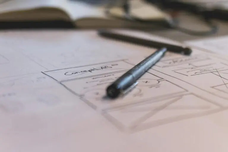 Notebook sketch with handwritten notes and pen for planning or design work