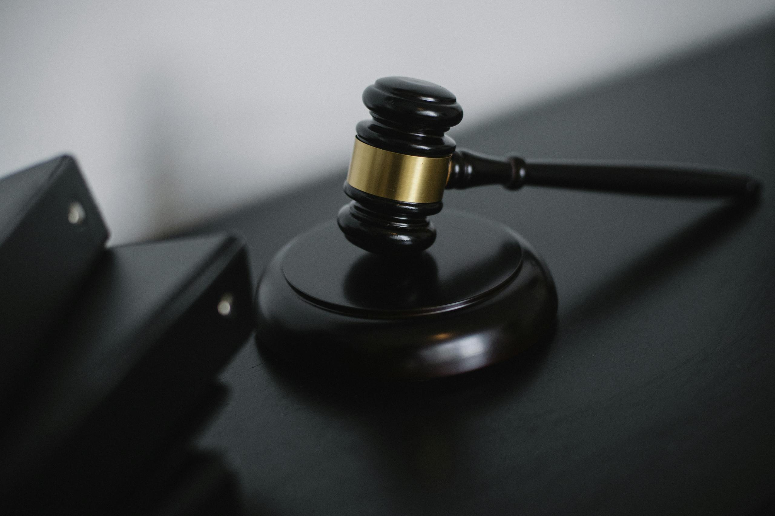 Close-up wooden gavel on desk symbolizing justice, law, and legal authority