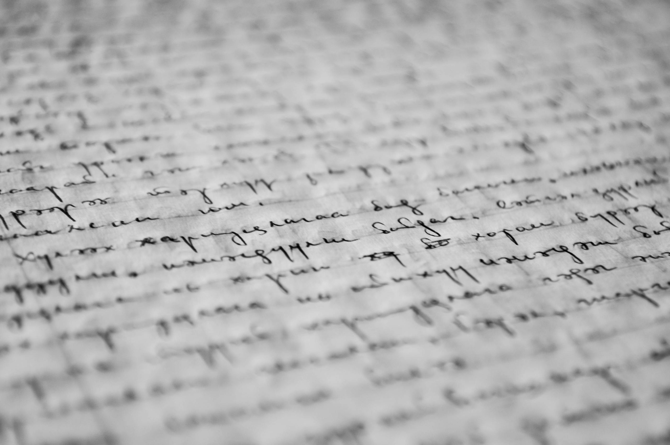 Close up of handwritten journal pages with pen showing personal reflective writing