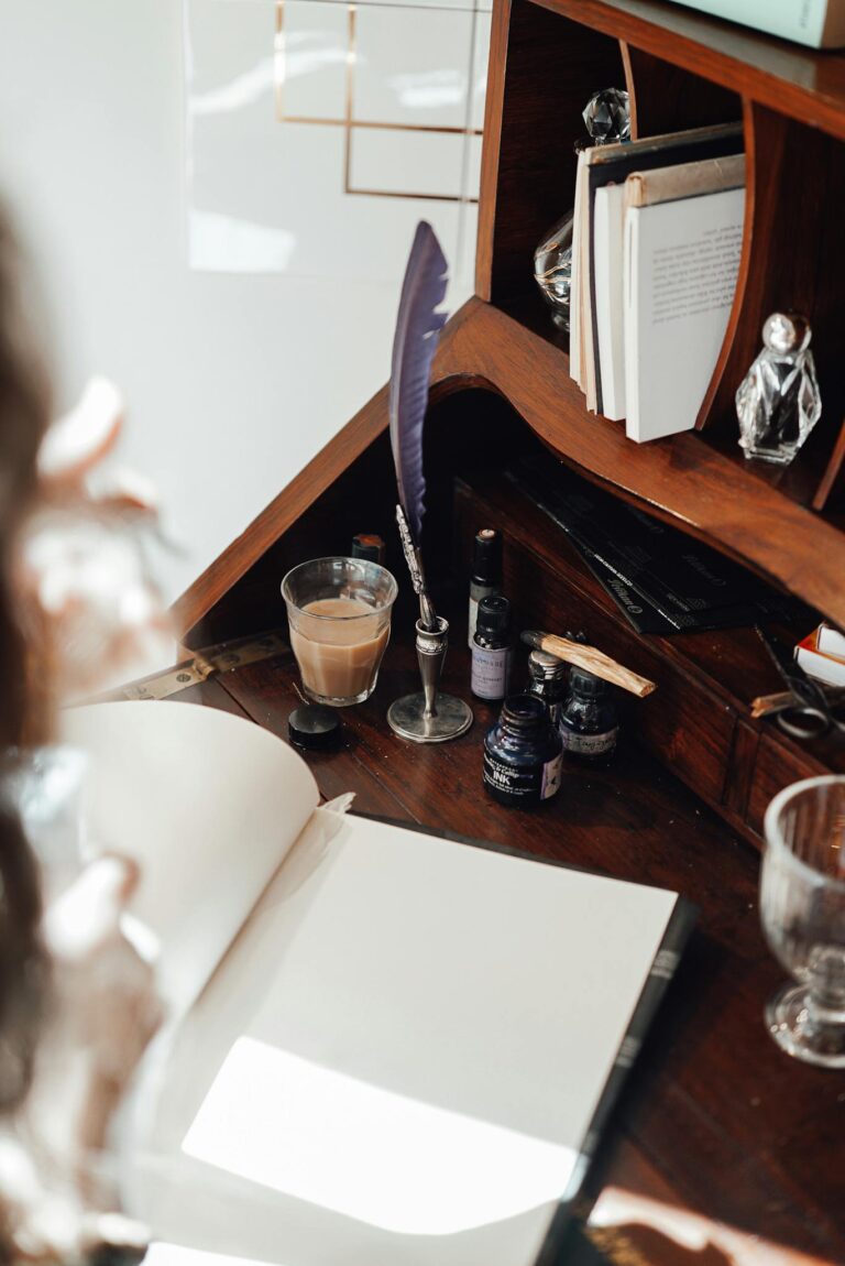 Cropped view of anonymous female author working at retro table