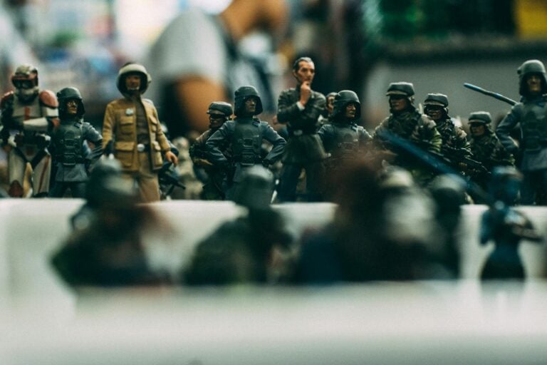 Detailed close-up of miniature toy soldiers arranged in military battle formation