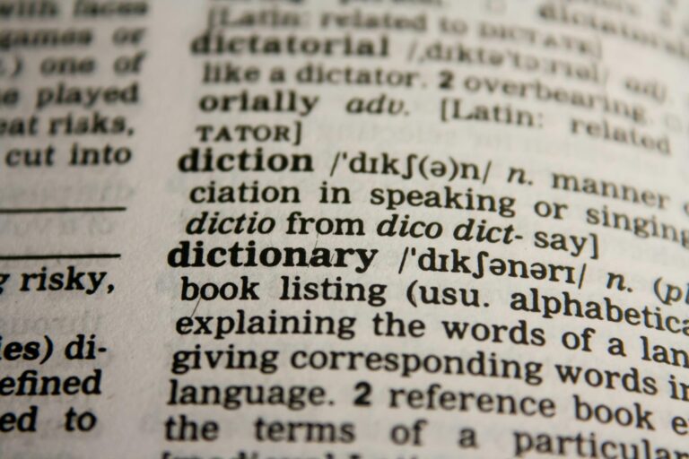Detailed close-up of dictionary page highlighting word dictionary and definition