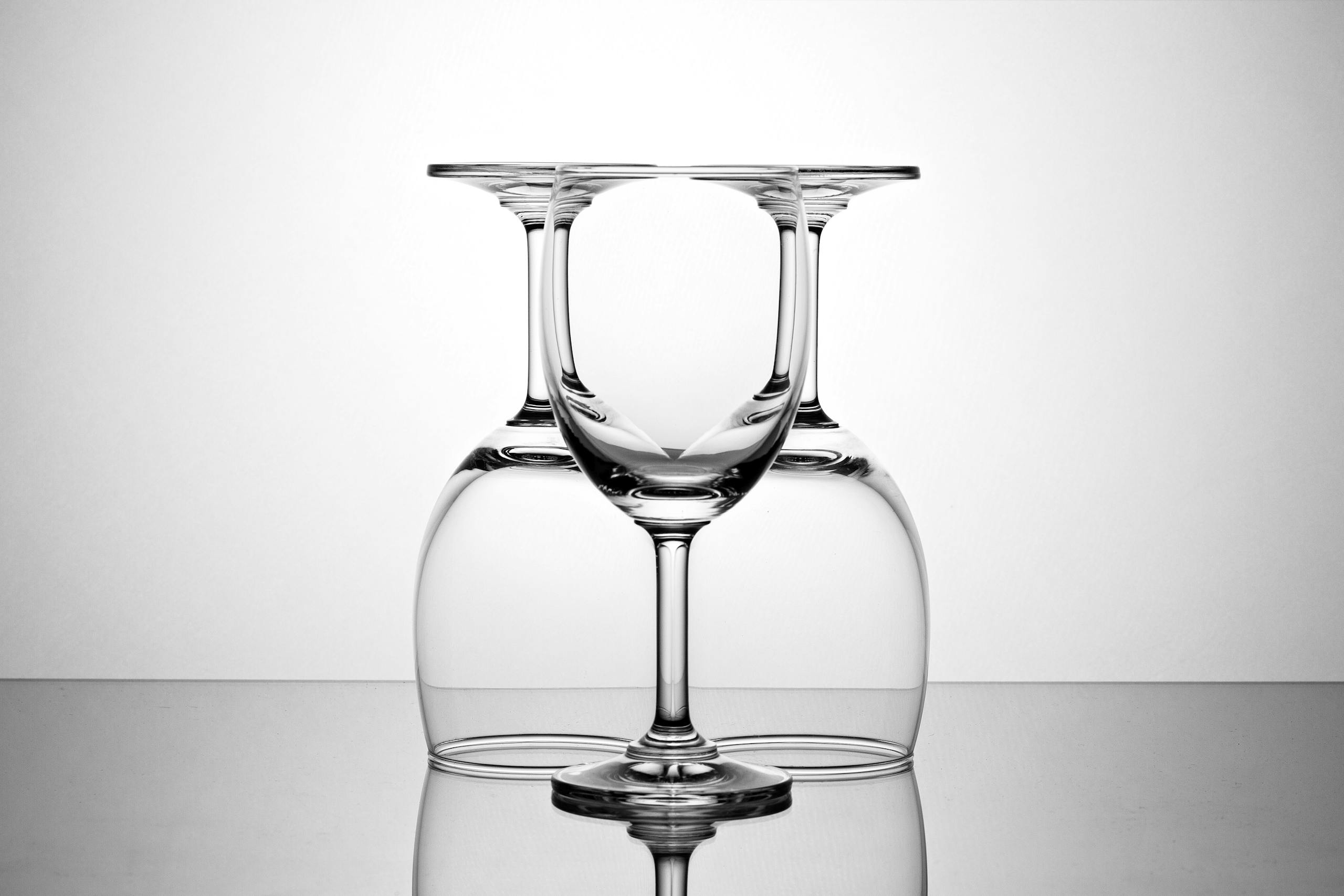 Elegant display of inverted and upright wine glasses showcasing symmetry.