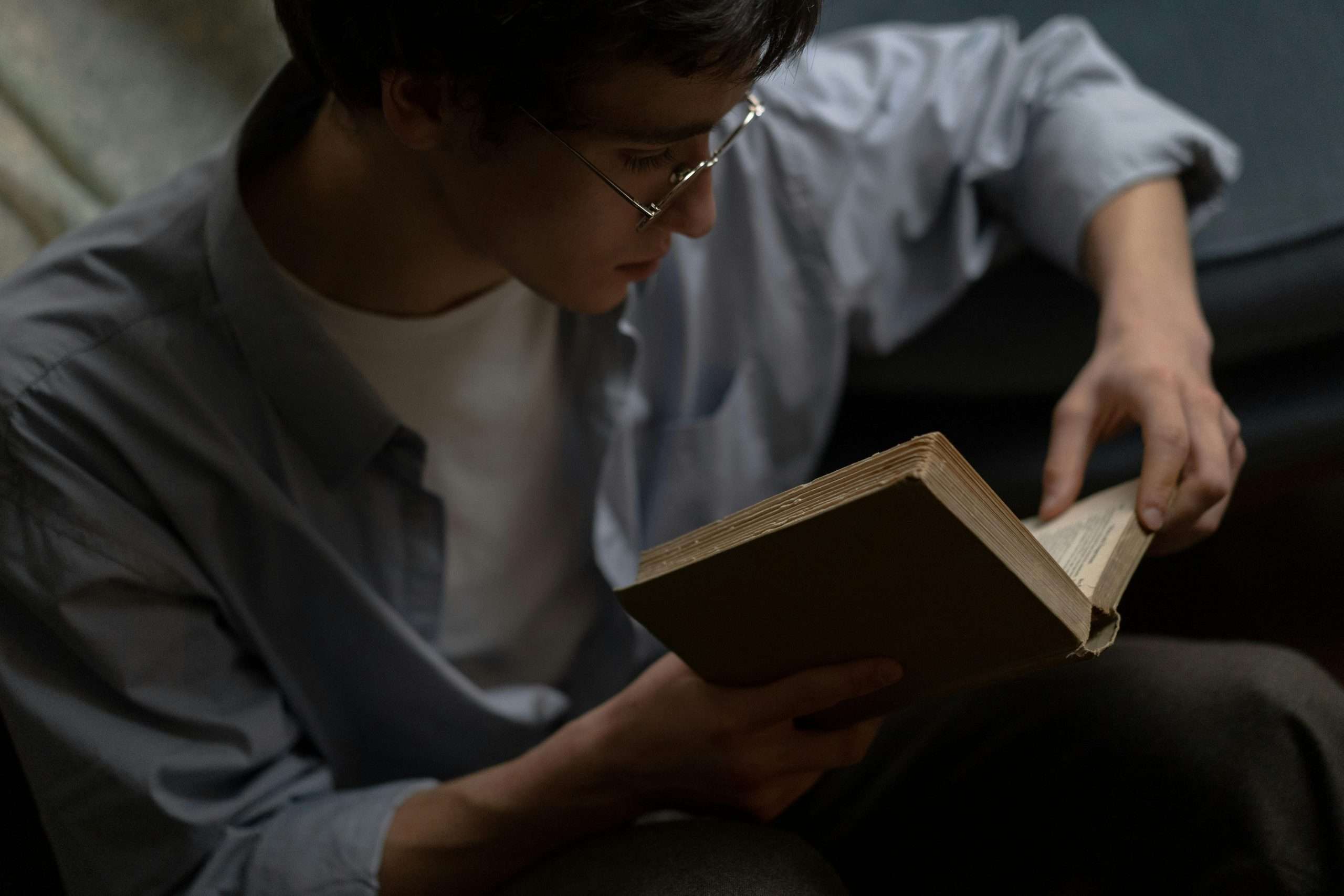 Man reading a book alone in quiet solitude