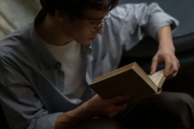Man reading a book alone in quiet solitude