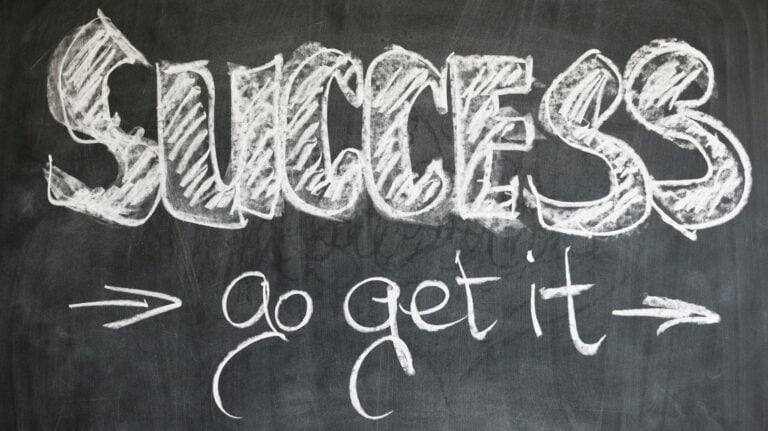 Motivational chalkboard displaying success and encouragement messages in chalk.