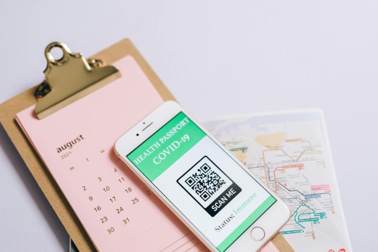 Smartphone displaying health passport and calendar for organized travel planning
