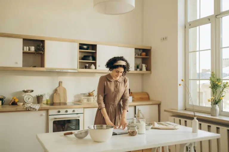 Solo introvert peacefully preparing a meal in calm organized kitchen environment
