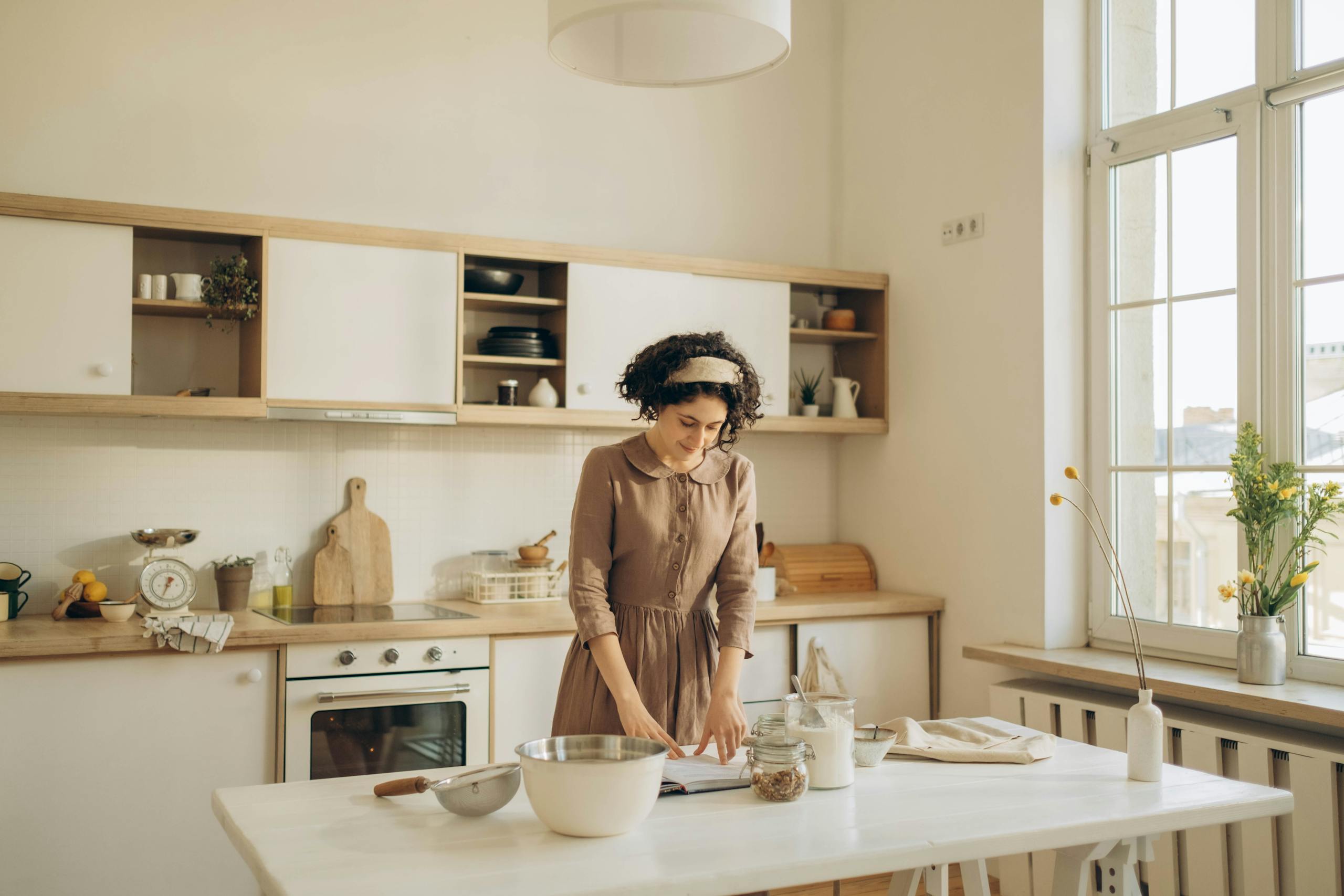 Solo introvert peacefully preparing a meal in calm organized kitchen environment