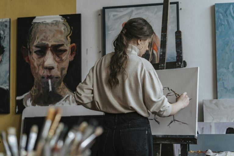 Two ISFP partners sharing quiet creative moment together in art studio