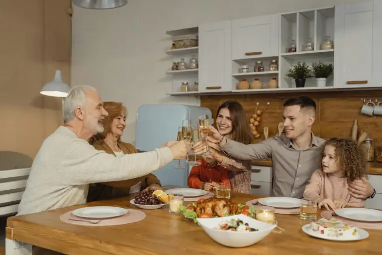 Joyful family toasting together at dinner table celebrating special occasion