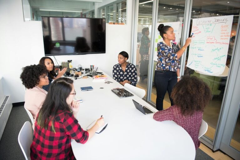 Multicultural office team engaging in collaborative brainstorming at conference table