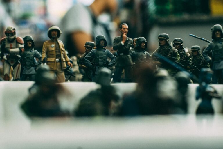 Detailed close-up of miniature toy soldiers arranged in military battle formation