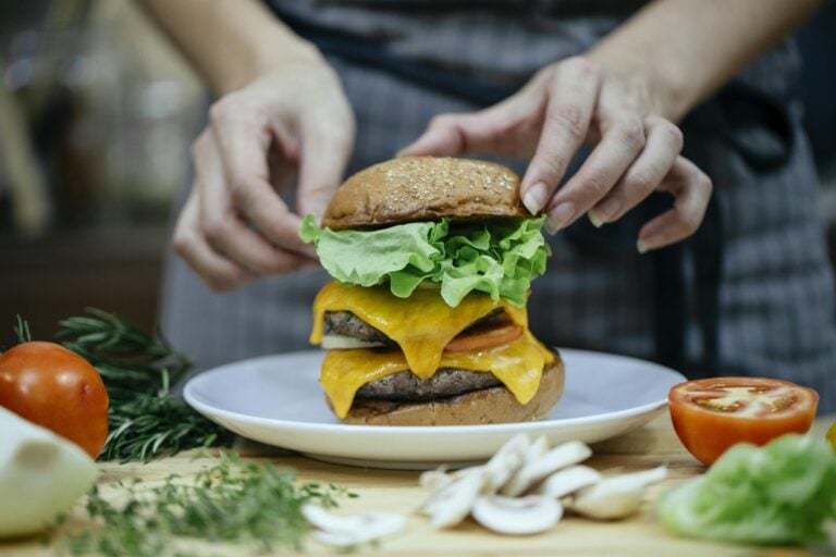 ISFJ parent carefully preparing child's lunch with detail-oriented practical care